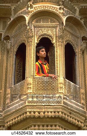 Stock Image - palace, looks, sandstone, window, out, boy. Fotosearch