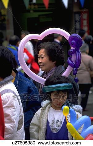 Stock Image - parade, people, watching, girl, heart, woman. Fotosearch