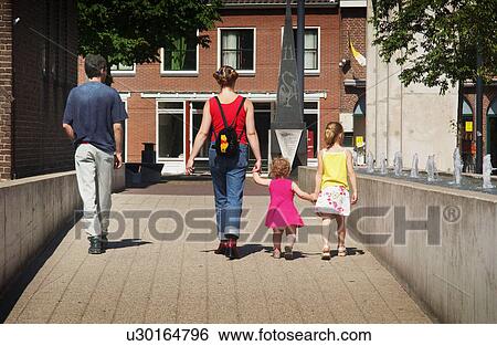 Stock Photograph - parents, walking, kids, children, family. Fotosearch