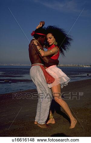 Stock Photo - people, beach, love, fashion, water, woman. Fotosearch