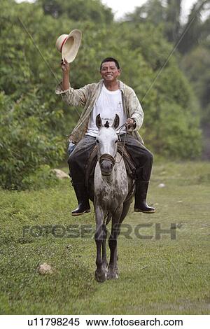 Stock Photography - people, guatemala, person, horse, family. Fotosearch