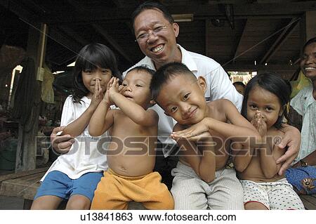 Stock Image - person, orpanage, working, cambodia, people. Fotosearch