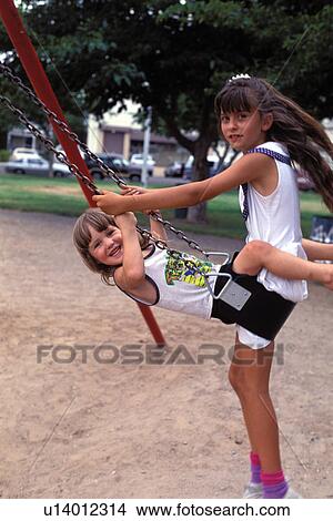 playground, released, fun, swinging, girls, model View Large Photo Image Picture - playground, released, fun, swinging, girls, model. Fotosearch