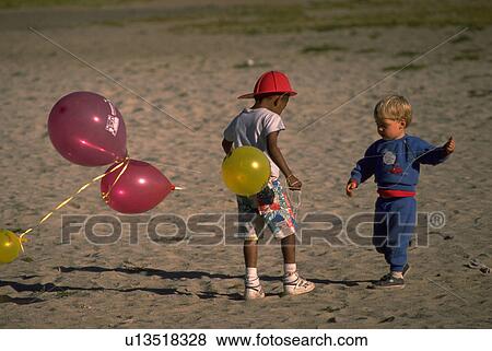 playing, people, kids, children, sport, beach View Large Photo Image Stock Photo - playing, people, kids, children, sport, beach. Fotosearch