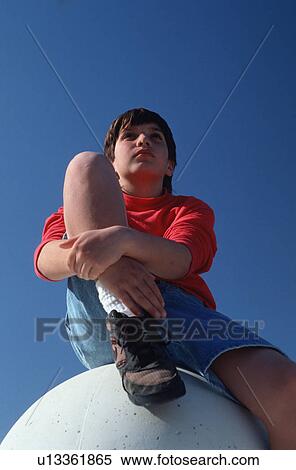 released, sphere, sitting, boy, model View Large Photo Image Stock Photography - released, sphere, sitting, boy, model. Fotosearch