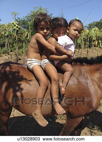 Stock Image - riding, horse, nicaragua, children, person, people. Fotosearch