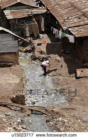 Stock Photo - roofs, person, tin, rusted, kenya, people. Fotosearch