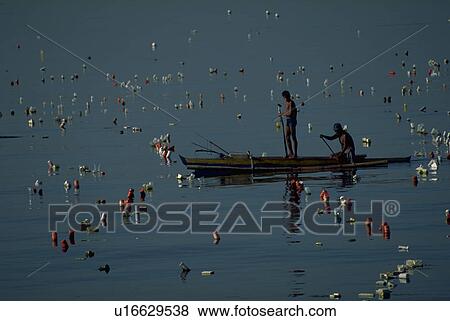 Stock Photo - rowboat, people, males, men, two, water. Fotosearch