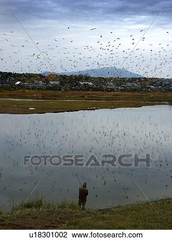 Stock Image - sakhalin, person, tunaycha, lake, russia, people. Fotosearch