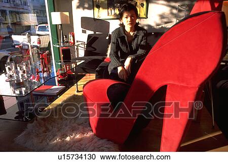 Stock Image - shoe, girl, sitting, shopping, retro, woman. Fotosearch