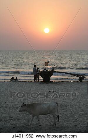 Stock Image - sunset, people, india, sun, person, beach. Fotosearch