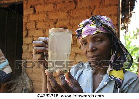 Stock Photo - tanzania, water, home, person, people, woman. Fotosearch