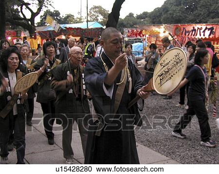 Stock Image - tokyo, person, procession, buddhist, japan, people. Fotosearch