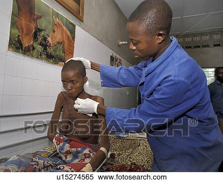 Stock Photography - treating, people, nurse, benin, person, woman. Fotosearch