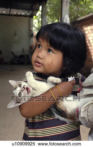 Stock Photography - use, girl, kitten, cambodia, person, people. Fotosearch