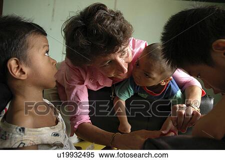 volunteer, hand, american, cambodia, person, people View Large Photo Image Stock Photography - volunteer, hand, american, cambodia, person, people. Fotosearch