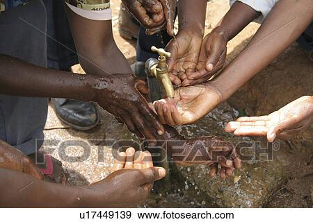 Stock Photo - washing, people, villagers, tanzania, person, water. Fotosearch