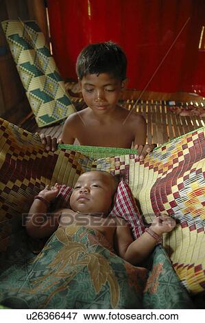 Stock Photo - watching, people, boy, cambodia, person, baby. Fotosearch