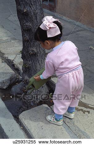 watering, hispanic, kid, child, girl, mexican View Large Photo Image Stock Photography - watering, hispanic, kid, child, girl, mexican. Fotosearch
