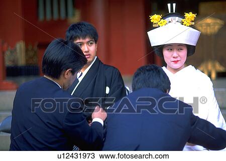 Stock Image - wearing, party, bride, groom, japanese, wedding. Fotosearch