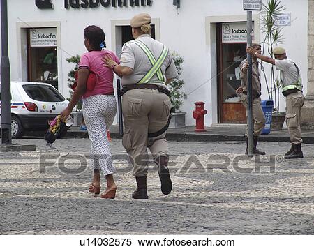 Stock Photography - arresting, person, police, tourist, brazil, people. Fotosearch