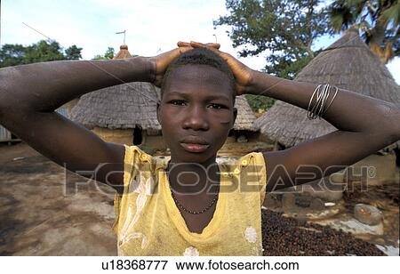 Stock Photo - benin, house, 7496, person, girl, people. Fotosearch