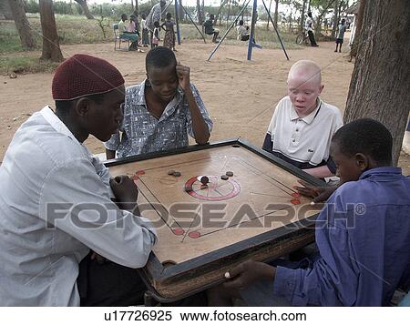 Stock Photography - board, person, playing, boys, tanzania, people. Fotosearch