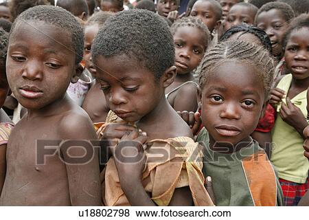 Stock Photo - boys, people, namibia, children, person, food. Fotosearch