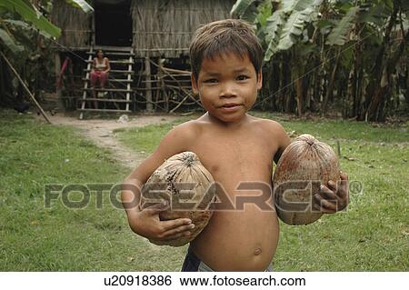 Stock Photograph - carrying, people, boy, cambodia, person, business. Fotosearch