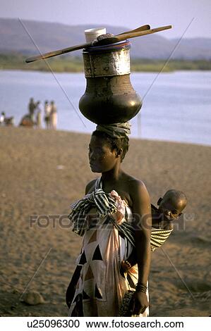 Stock Image - carrying, people, mozambique, person, fitness, woman. Fotosearch