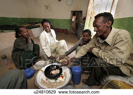 Stock Photo - children, food, person, house, people, family. Fotosearch