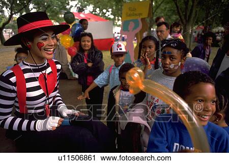 Stock Image - clown, lake, festival, youngsters, children. Fotosearch
