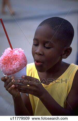 Stock Photo - cone, boy, snow, enjoy, prepares, young. Fotosearch