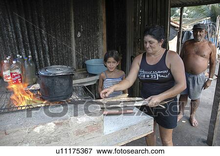Stock Photo - cooking, people, brazil, fire, person, woman. Fotosearch