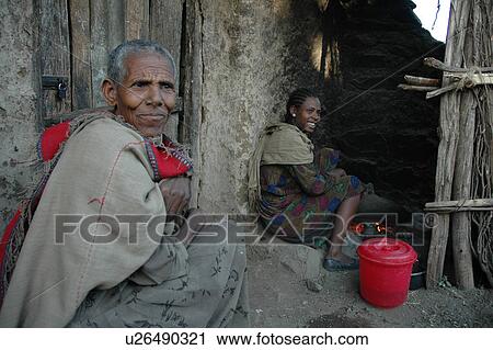 Stock Image - cooking, people, ethiopia, fire, person, woman. Fotosearch