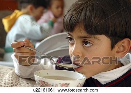 Stock Image - eating, child, boy, kid, person, people. Fotosearch
