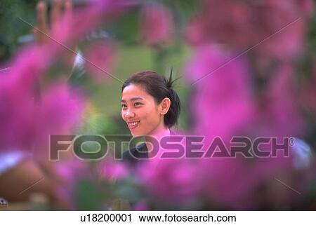 Stock Image - female, flowers, young, beauty, spring, woman. Fotosearch
