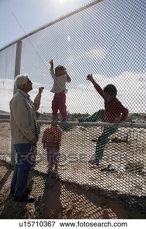 fence, border, usa, children, person, people View Large Photo Image Stock Photo - fence, border, usa, children, person, people. Fotosearch