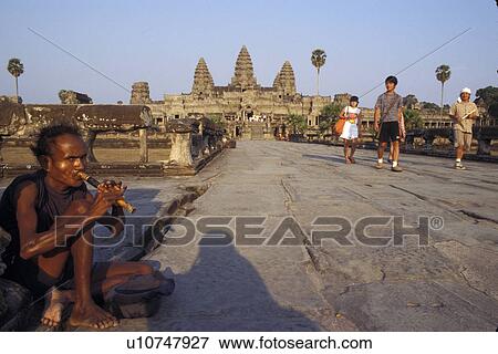 Stock Photo - flute, person, playing, beggar, cambodia, people. Fotosearch