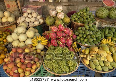 Stock Photo - fruits, people, tropical, laos, person, food. Fotosearch