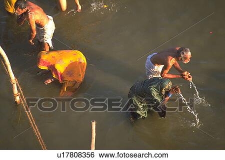 Stock Photograph - ganges, hindu, bathing, worhsipers, peasant, water. Fotosearch