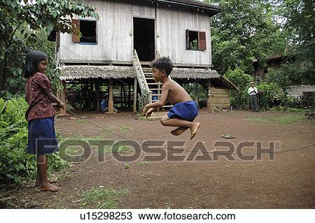 Stock Image - kampong, person, skipping, boy, cambodia, people. Fotosearch