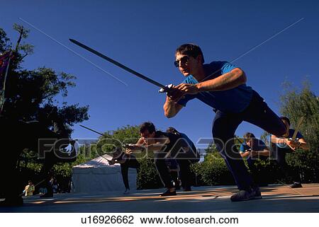 Stock Image - lake, people, festival, fencing, dance, party. Fotosearch
