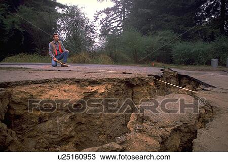 Stock Image - male, earthquake, crack, measuring, nature. Fotosearch