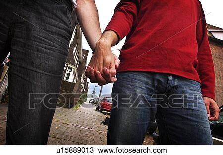 Stock Image - men, hands, holding, males, homosexuality. Fotosearch