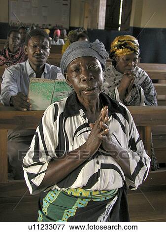 Stock Photo - mwanza, person, mass, catholic, tanzania, people. Fotosearch