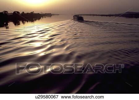 Stock Photo - nile, ship, surface, wake, leaves, cruise. Fotosearch