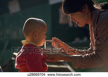 noodles, mother, boy, baby, feeds, young View Large Photo Image Picture - noodles, mother, boy, baby, feeds, young. Fotosearch