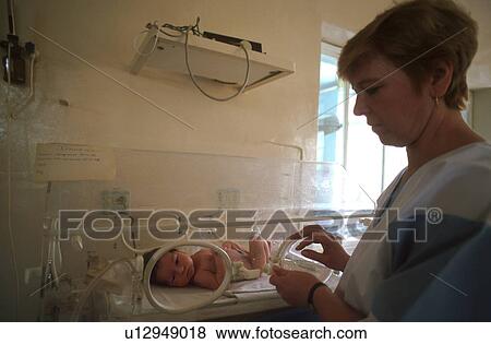 Stock Photo - nurse, people, 4418, person, hand, baby. Fotosearch