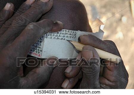 Stock Image - person, meregeta, ethiopia, book, people. Fotosearch